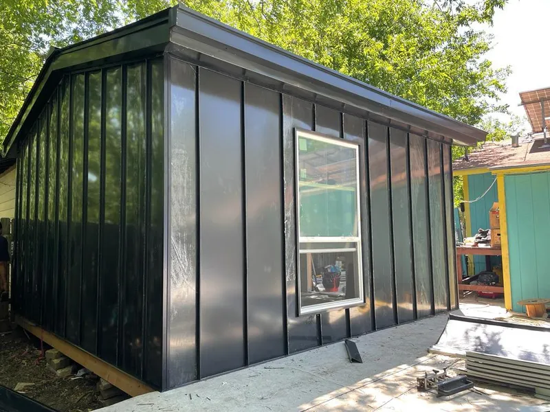 Black standing seam metal wall panels for Metal Roof Installation in Solon