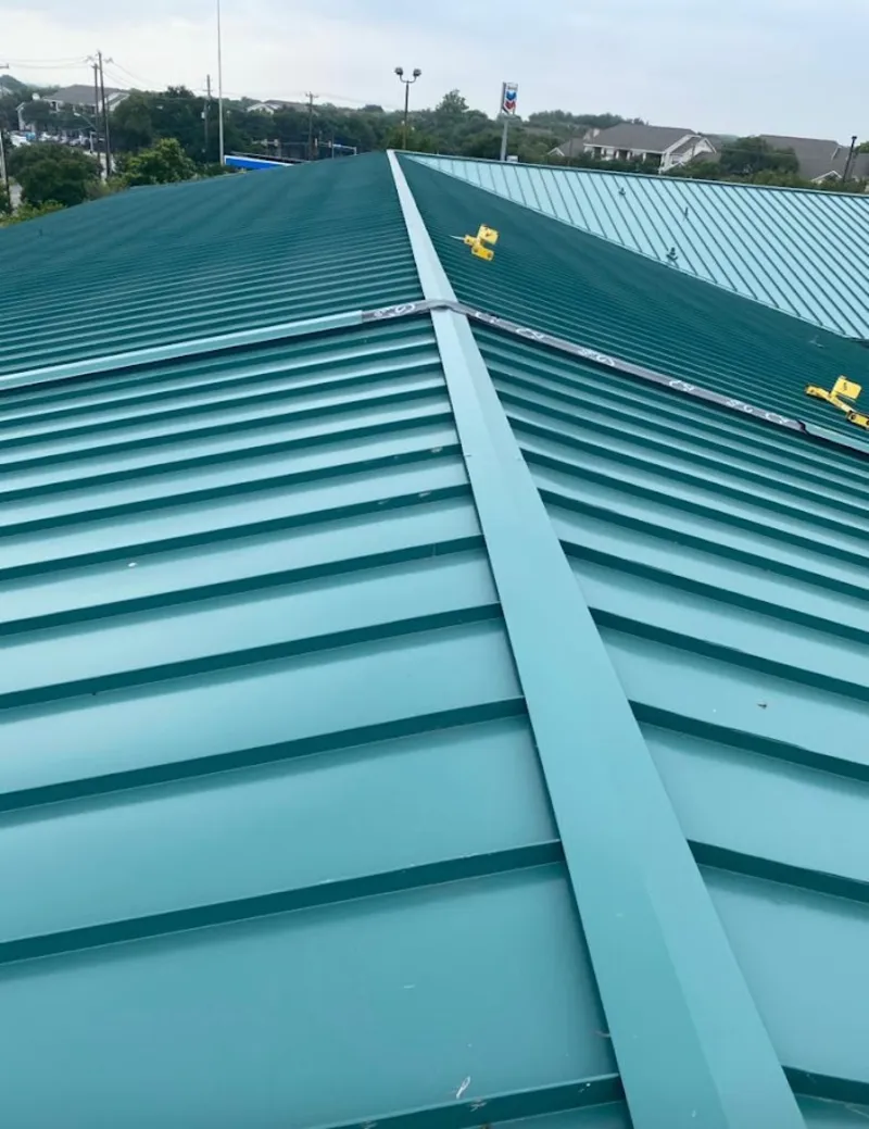 Green commercial metal roof ridge and valley for Metal Roof Repair in Solon
